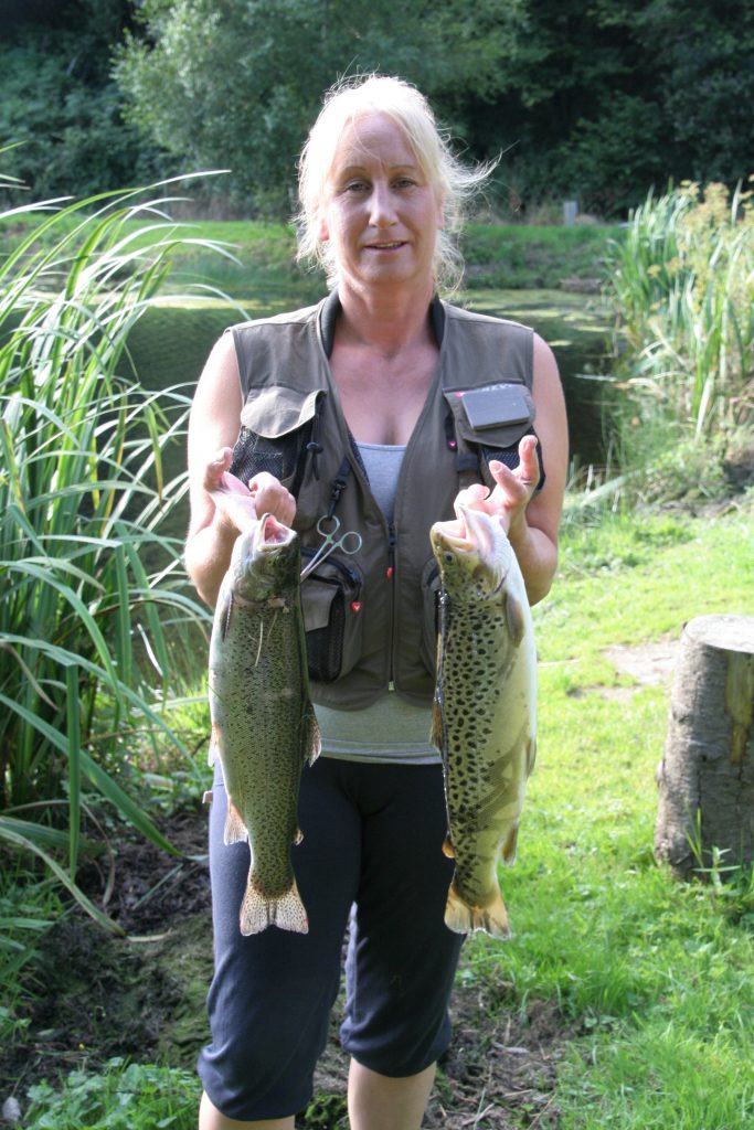 Debbie Tucker with brace of Bratton Trout including a 3lb 1oz brown trout