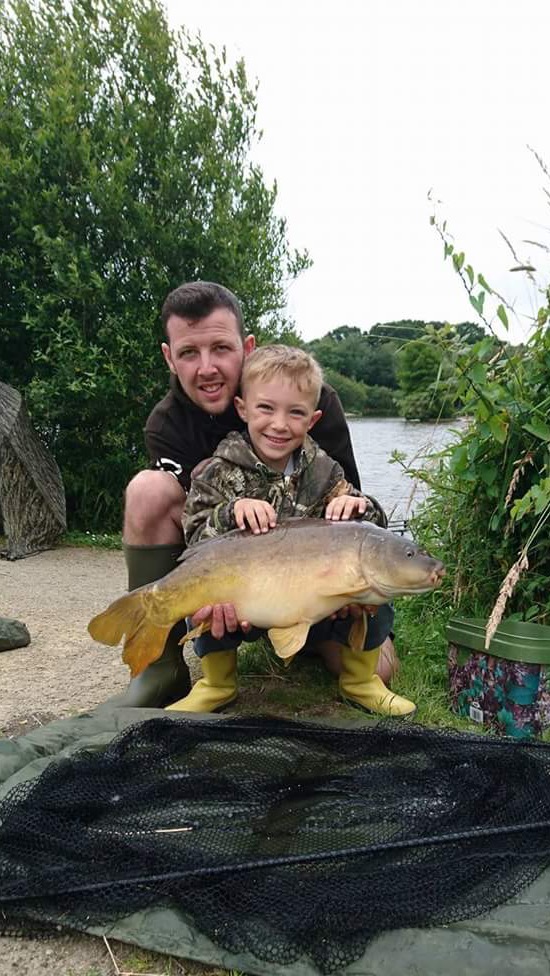 Craig Batti and son Cayden fishing on Beattie's lake on the summer house swim using WLM baits. With  just one of his many catches. 