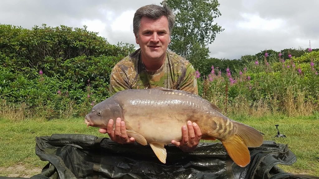 Phill Bate with one of his catches a 20lb 15oz beauty fishing BQ Wafters in the dam wall on Beatties